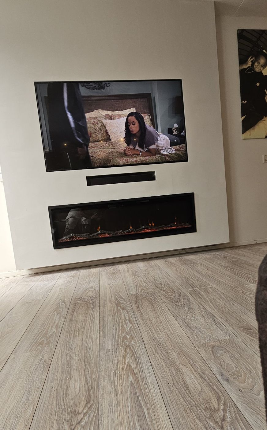Tweede cinewall in Putten met verzonken tv, soundbarnis en sfeerhaard, foto 2